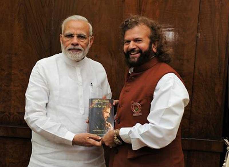 PM Modi unveils biography of musician Hans Raj Hans  