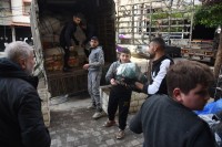 Volunteers loading relief material for quake-hit Syria in Lebanon's capital Tripoli
